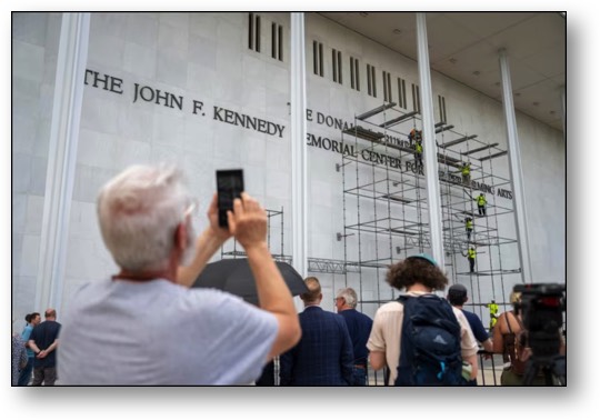 Workers removing the Fascist Pig's name!