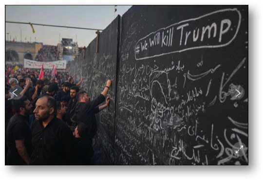 Iranian mourners write messages on a wall